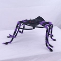 Close-up of purple and black plush spider legs with red eyes for pet Halloween costume - Purple Black