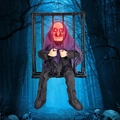 Hanging Halloween prisoner witch in cage with glowing red eyes and purple cloak decoration - Purple Clothes Witch Cage