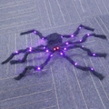 Giant Halloween spider with purple LED legs and glowing red eyes for spooky party decor - Pure Black