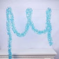 Detail of a 10m shimmering light blue tinsel garland for festive party decorations - Iridescent Tinsel / 2m / Lake Blue
