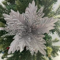 Close-up of silver mesh poinsettia flower decoration with glitter on Christmas tree - Silver