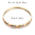 Detail view of wave cuff bracelet with colorful rainbow zircon stones in gold finish - Rainbow Wave Open Style (YJC-C-05)