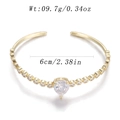 Golden open cuff bracelet with large heart-shaped white zircon and smaller round accents - Heart Main Stone Open Style (YJC-C-10)