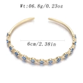 Golden open cuff bracelet with light blue zircon stones and 6cm inner diameter size - Row Blue Gem Open Style (YJC-D-16)