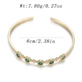 Golden open bangle with 5 round green cubic zirconia stones, inner diameter 6cm, 7.8g - Five Green Gem Vintage Style (YJC-E-12)