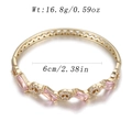 Gold-finished geometric bangle featuring a pink rectangular gemstone and zircon accents - Pink Gem Round Diamond Geometric Style (YJC-F-05)