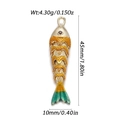 Macro detail of enamel koi fish pendant with gold scales and red gem eye accent - Gradient Orange Green Koi (YSN162-04)