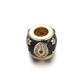 Close-up of gold-plated evil eye charm bead with black enamel and blue cubic zirconia - Gold Black (Evil Eye + Star)