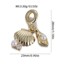 Detailed view of gold ocean shell pendant with white pearls and sparkling cubic zirconia - Shell Artificial Pearl Style (DBN167-10)