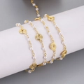 Detail of light gold necklace chain with white pearls and spiral metal wire discs - Spiral Pearl Style (5) / 1m