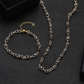 Golden stainless steel evil eye jewelry set featuring a necklace and bracelet with black beads - Black Hammered Evil Eye Necklace and Bracelet Set (2)
