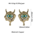 Detail view of Evil Eye devil earrings with gold horns and copper metal tassels - Devil Horn Blue Yellow Eye (YSE008-5)