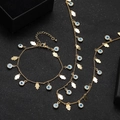 Gold Hamsa Hand and Evil Eye necklace and bracelet set on black velvet cushion - Blue Hamsa Hand Evil Eye Necklace and Bracelet Set (11)