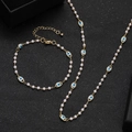 Handmade golden evil eye jewelry set featuring white pearls and blue eye charms - Multicolor Evil Eye Artificial Pearl Necklace and Bracelet Set (20)