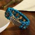 Detail of teal paracord survival bracelet with bronze decorative metal buckle - 19cm / Teal Blue (ABL165-1)