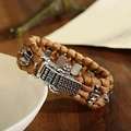 Close-up of braided survival bracelet with vintage silver buckle and mechanical closure - 19cm / Brown (ABL165-2)