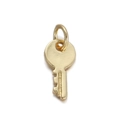 Close-up of a gold-plated key-shaped metal pendant charm for DIY jewelry making - Key-shaped