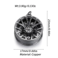Detail view of gunmetal car wheel hub pendant with white crystals and brass texture - Gunmetal Rim (100-03)