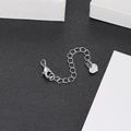 Macro detail of silver extender chain with lobster clasp and engraved heart charm - Silver Extension Chain (YSD012-24)
