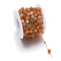 Handmade stainless steel chain with orange stone beads on a white spool for DIY jewelry - 1m / Orange