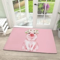 Close-up of pink diatom mud mat with watercolor pig illustration on a light wood floor - 40x60cm (Diatomite) / Pink Pig Daisy