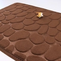 Soft dark brown memory foam bath mat featuring a 3D embossed pebble texture surface - Coffee