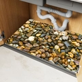 Detailed view of waterproof pebble pattern mat used as kitchen sink cabinet liner - Brown Pebbles Style
