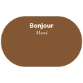 Close-up of brown oval bathroom mat featuring white Bonjour and Merci lettering - Brown