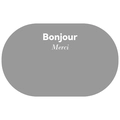 Detail of grey oval bath mat featuring Bonjour and Merci text on a soft surface - Gray