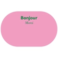 Close-up of minimalist pink bath mat featuring green Bonjour and Merci text detail - Pink