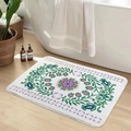 Detailed view of plush floral bathroom mat with intricate ethnic patterns near bathtub - Floral-7