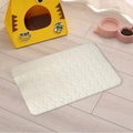 Detail of breathable coral fleece pet mat with circular quilting on light wood floor - 40x60 / Off White