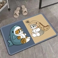 Detail showing non-slip shark and dinosaur cat pattern mat on grey stone tiles - Cat Pattern 6