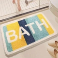 Tapis de bain absorbant antidérapant avec blocs jaunes et bleus et lettrage BATH - Style Bath