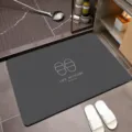 Absorbent diatom mud bath mat in dark grey with Life Attitude text and slippers icon - Minimalist-2