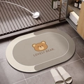 Detail of absorbent diatom mud bathroom mat featuring a cute cartoon bear illustration - Happy Little Bear (Happy Little Bear Oval-10)