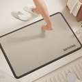 Detail of a beige diatom mud bath mat with a black border and BATHING text print - Minimalist Rectangular-5