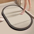 Detail view of oval anti-slip bath mat with concentric texture and foot stepping on it - Straight Edge Round - Stacked Spring (Soft Style) / Agarwood / 40x60cm
