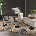 Detail of modern geometric rug with yellow and grey hexagon patterns in a cozy patio setting - Yellow Grey Black Hexagon Pattern (SBT-JIANYUE-9) / 40cmx60cm (Skin-friendly Fleece)