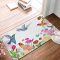 Detail of floral diatom mud mat with hummingbird design on rustic wooden floor - Hummingbird & Flower
