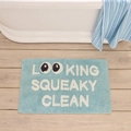 Detail of plush light blue bath mat featuring playful white letter text on wood floor - 822 Road-8 / 40*60cm (Skin-Friendly Surface)