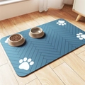 Close-up of a blue diatomaceous earth pet feeding mat with white paw prints on wood floor - 30*40cm / Skin-Friendly Fleece / Gray Blue (Dog Mat-13)