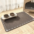 Close-up of brown diatom mud pet feeding mat with bone patterns on wooden floor - 30*40cm / Deep Brown Bone & Paw Border - Flannel Surface (Dog Mat-21)