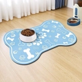 Detail of light blue bone-shaped pet feeding mat with paw prints on a wooden floor - 30*40cm / Skin-Friendly Fleece / Light Blue (Dog Mat—24)