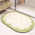 Détail d'un tapis de bain ovale absorbant style dessin animé aux tons vert et crème doux - Style Biscuit Vague Vert Crème (MJXMCDD-1) / 40*60cm (Velours Doux)