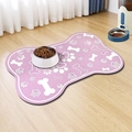 Detail of pink bone-shaped pet feeding mat with white paw prints on wooden floor - Pink Bone Shape (Dog Mat - 26) / 30x40cm / Pink