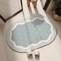 Detail of oval diatom mud bath mat with wave border and dots in light blue and cream - Wavy Polka Dot Blue (New Diatom Mud) / 40*60cm