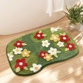 Detail of green floral bath mat with 3D tufted red and yellow flowers on wood floor - 40x60cm / Irregular Green Base Three-color Floral Style (mjx1017-8)