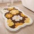Detailed plush texture of a thick floral bathroom mat with a brown and yellow pattern - 40x60cm / Irregular Brown Base Large Floral Style (mjx1017-9)