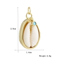 Détail du pendentif croix en coquillage doré avec dimensions de 2,8cm par 1,4cm et poids 4,8g - Pendentif Anneau en Coquille (01)